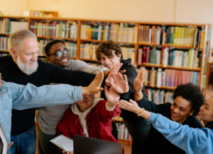 Mixed age group high fiving