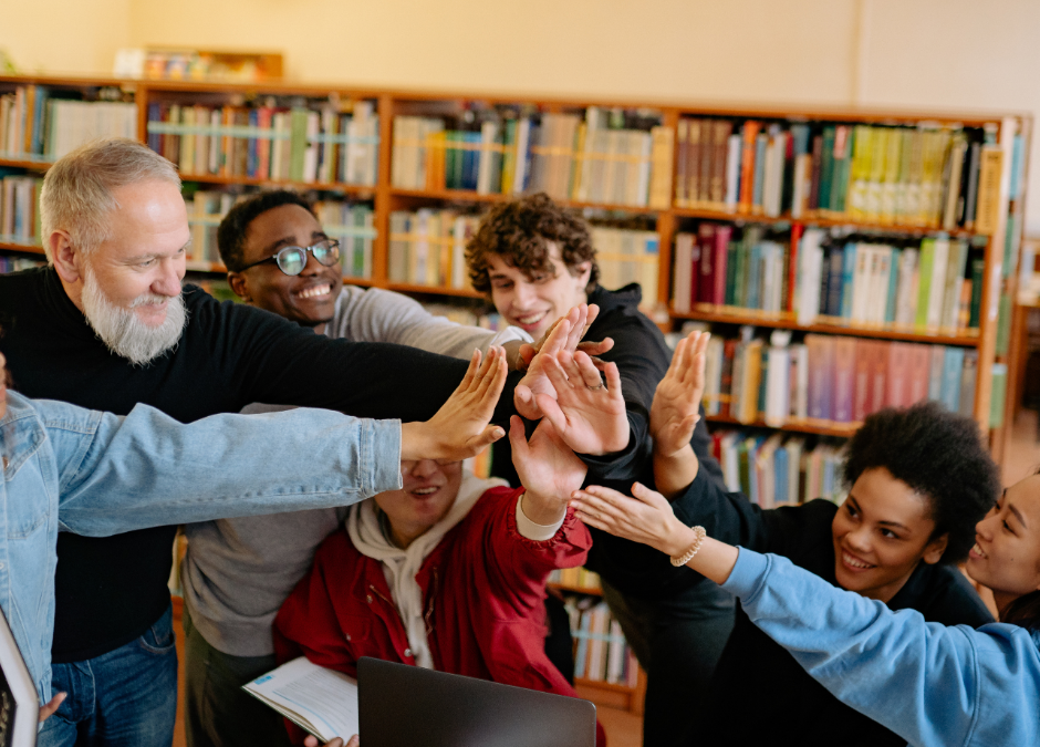 Mixed age group high fiving