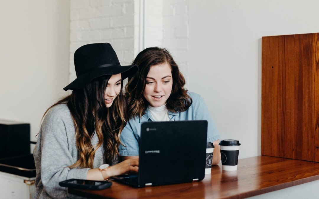 Parent and teen looking at a laptop